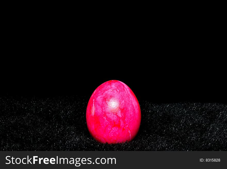 Beautiful Easter egg on the black background