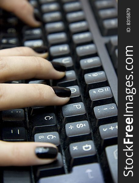 Computer keyboard and woman`s hands typing on it. Computer keyboard and woman`s hands typing on it.