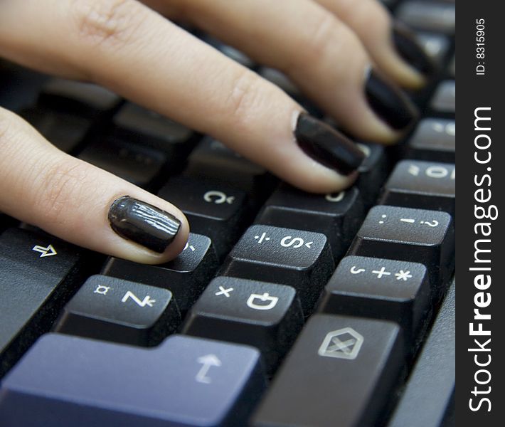 Computer keyboard and woman`s hands typing on it. Computer keyboard and woman`s hands typing on it.