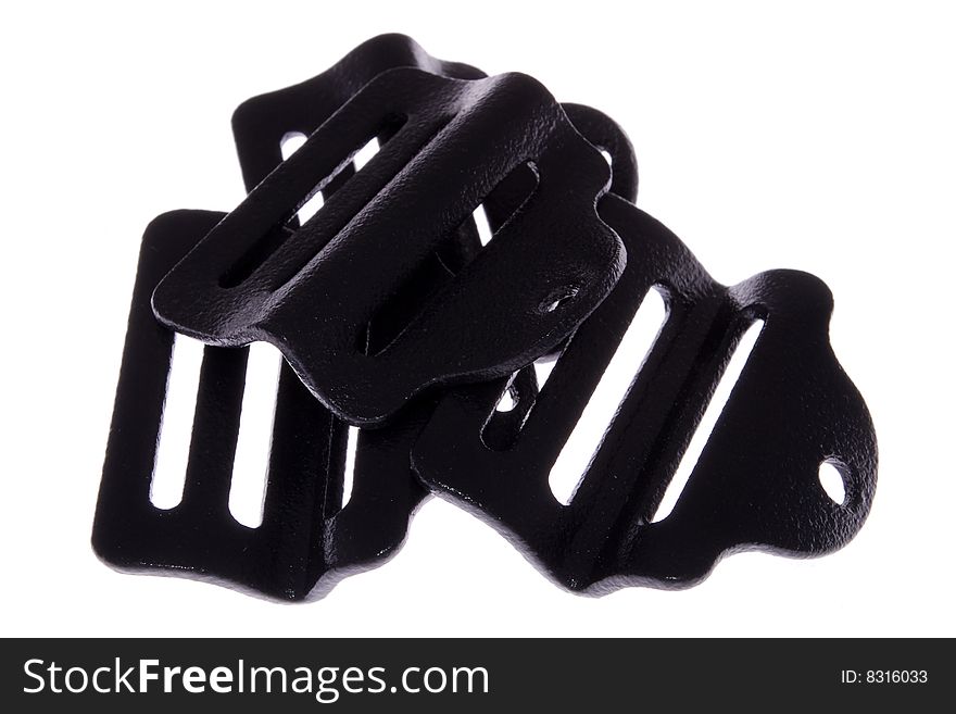 A view of a black clamps used for strap, isolated on a white background