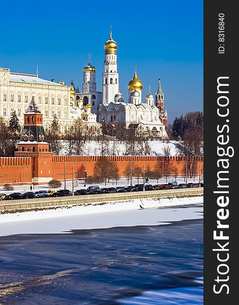 The red brick walls of famous Kremlin in Moscow with its churches. The red brick walls of famous Kremlin in Moscow with its churches