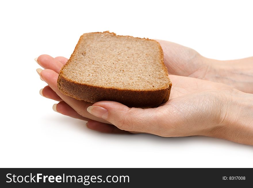 Piece of the pumpernickel in woman hands insulated on white background