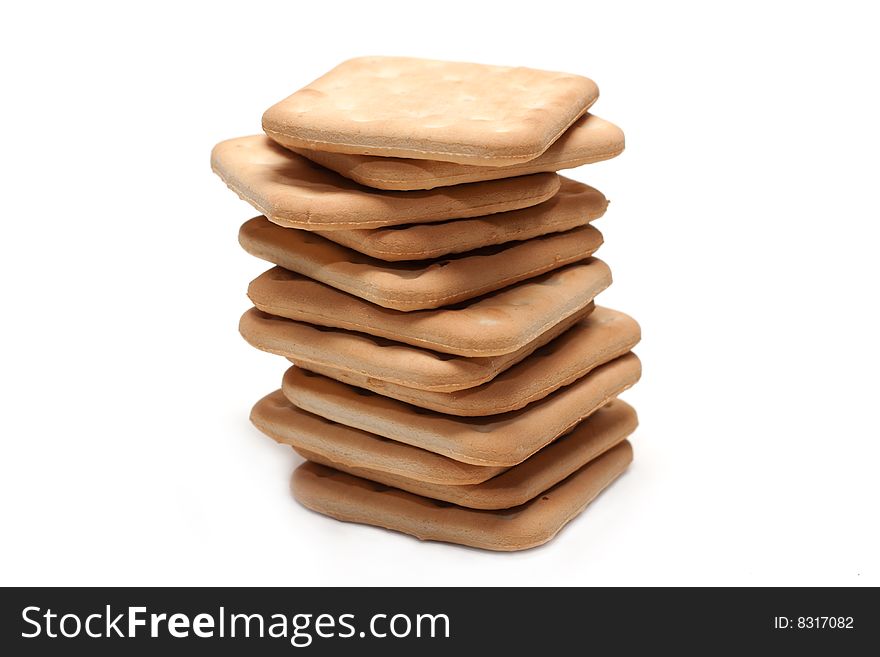 Crackers put by pile on white background