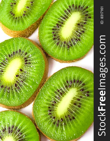 Green fresh kiwi slices background .