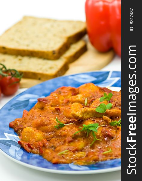 Slice of meat with dumplings-Gnocchi- and red bell pepper  sauce.