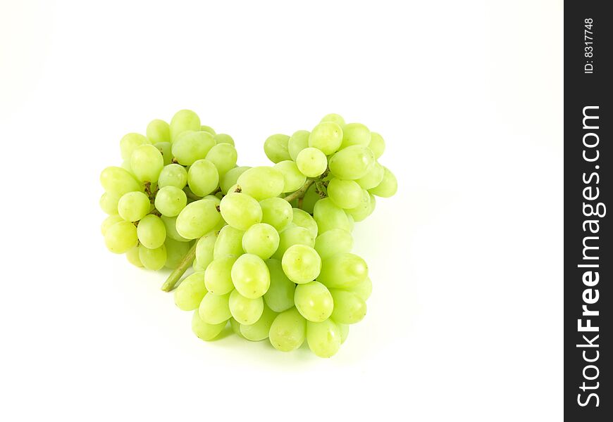 Green grapes on white studio isolated background.