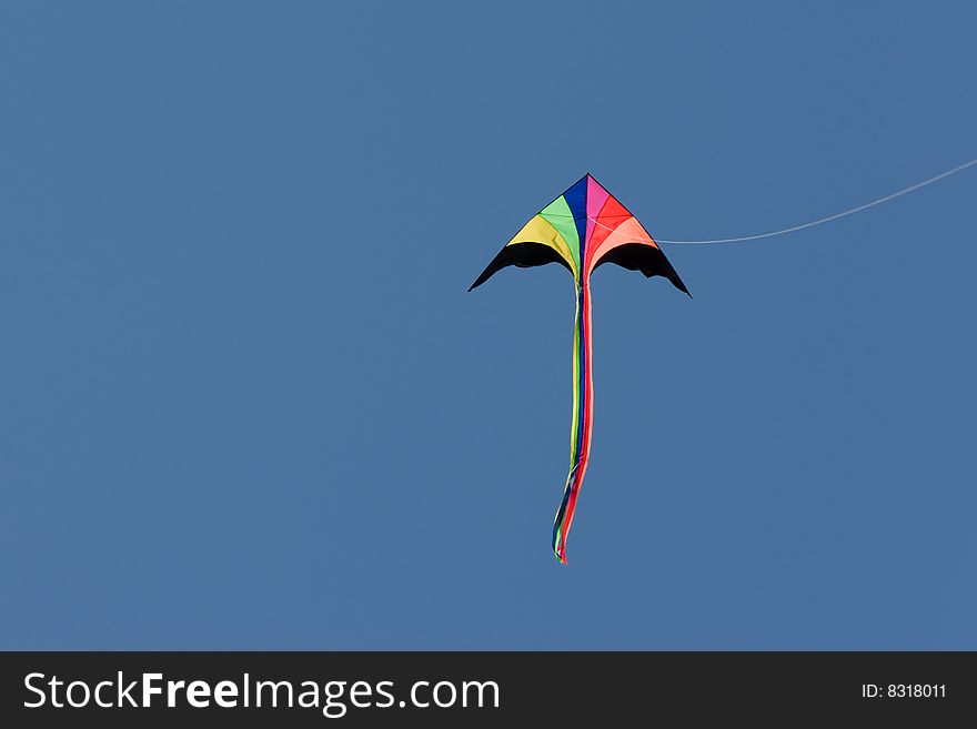 Colored kite in blue sky. Colored kite in blue sky