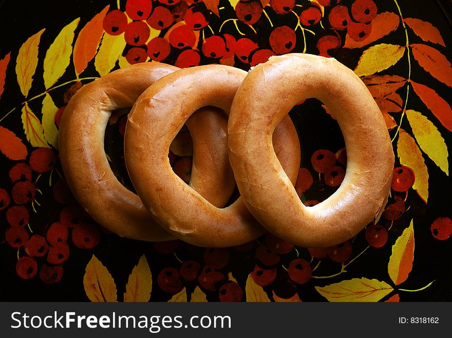 Bagels on tray with mountain ash pattern