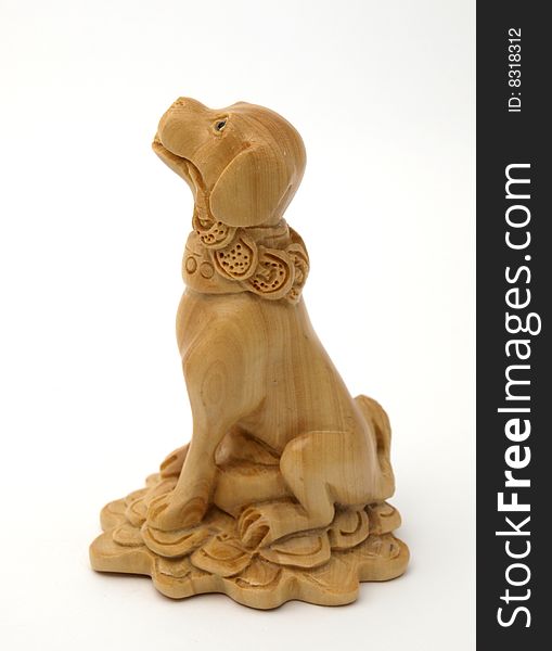 Wooden dog of handwork of master from the tree of mango. Wooden dog of handwork of master from the tree of mango