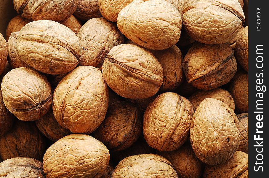 Fresh brown nuts background pattern