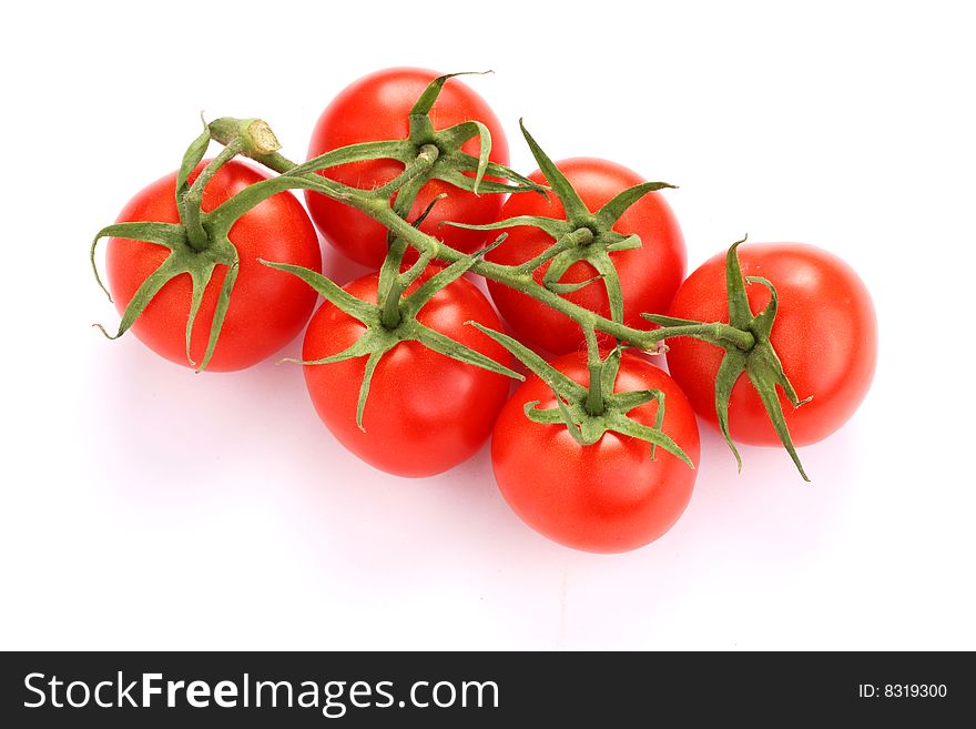 Fresh tomato bundle isolated on white. Fresh tomato bundle isolated on white.