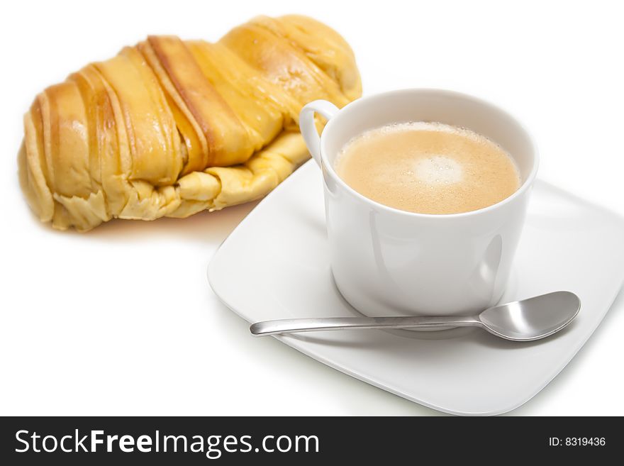 Cup of coffee and croissant. Cup of coffee and croissant
