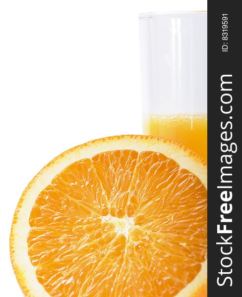 Close up of colorful orange slice and orange juice in glass  on white  background. Close up of colorful orange slice and orange juice in glass  on white  background