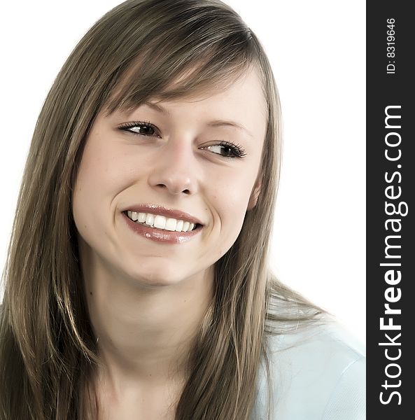 Closeup portrait of a happy young woman smiling isolated on white background