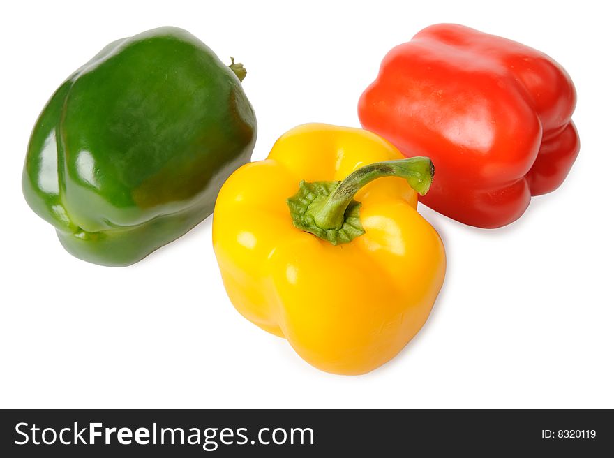 Red, green and yellow paprika isolated on white background