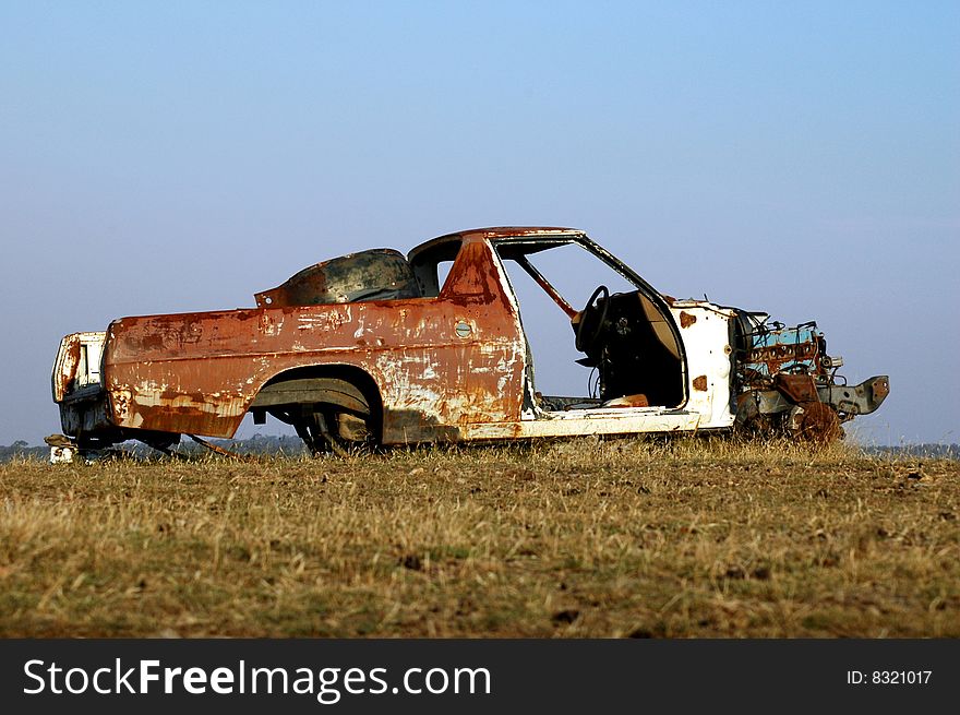 Abandoned car left in a field