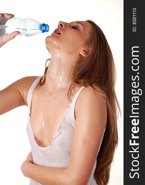 Woman in wet white shirt with bottle of water. Woman in wet white shirt with bottle of water