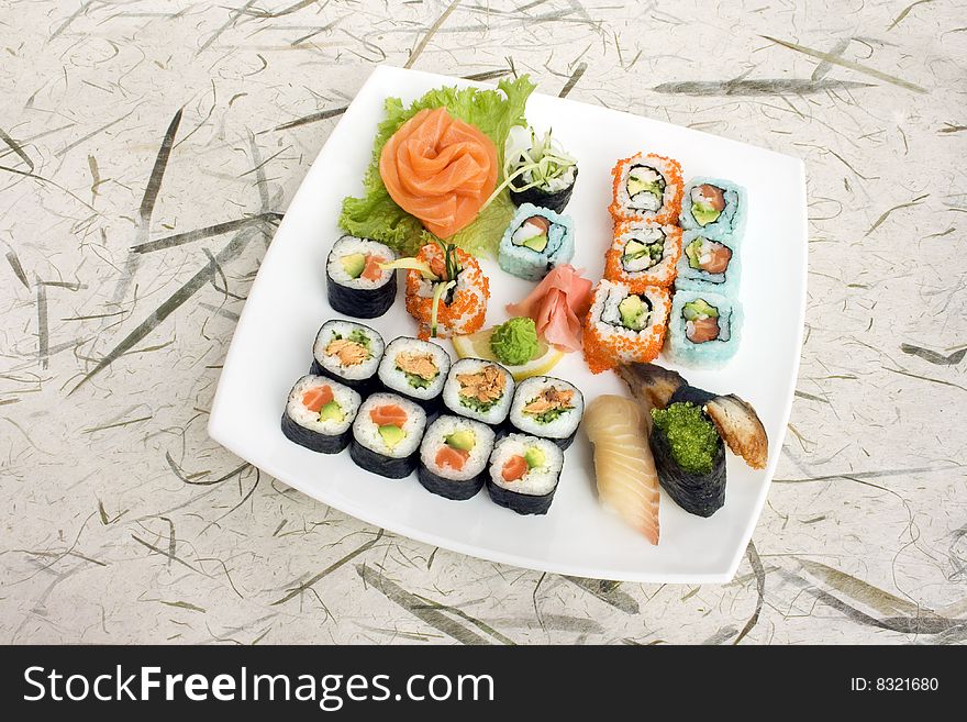 Sushi assortment isolated on a white dish. Sushi assortment isolated on a white dish