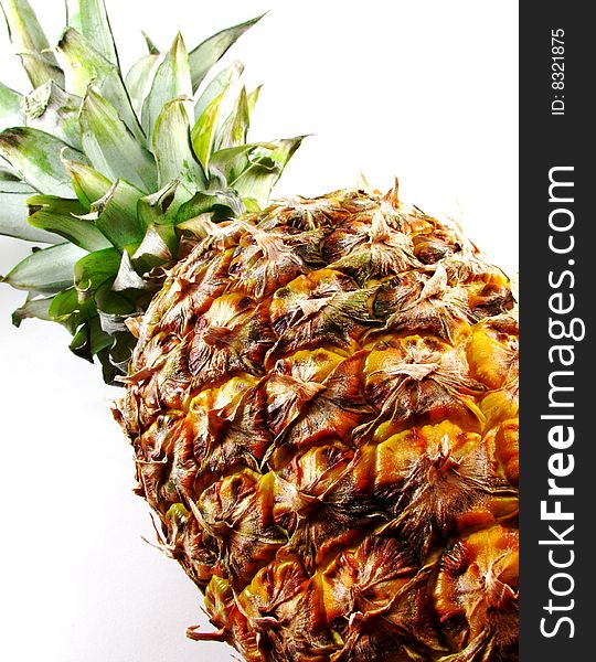 Closeup of a whole, fresh pineapple on a white background. Closeup of a whole, fresh pineapple on a white background