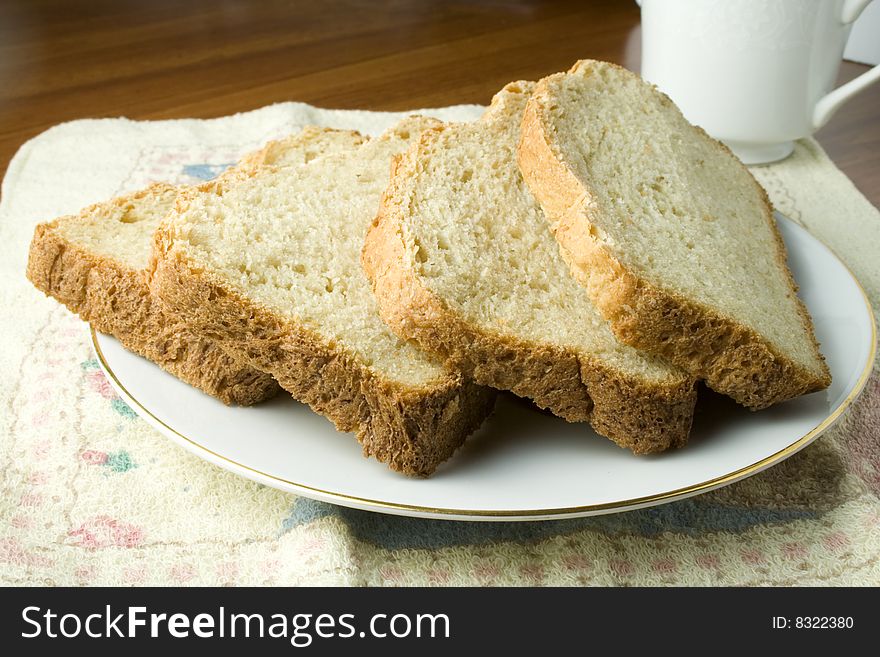 Fresh baked bread on saucer ready to eat or serve