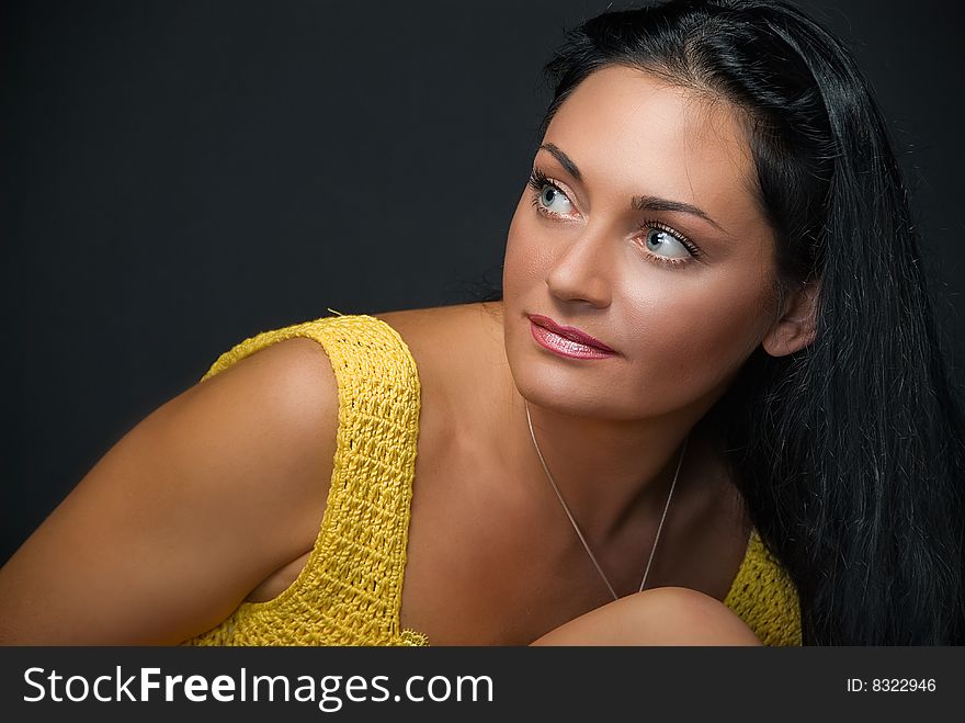 Portrait of charming young woman on black background. Portrait of charming young woman on black background