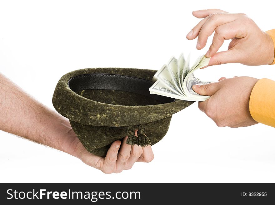 Man hand throw banknotes to hat in other. Man hand throw banknotes to hat in other