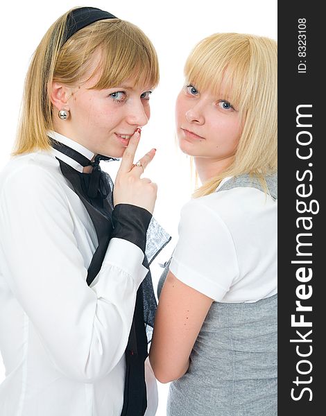 The two young glamour girls isolated on a white background