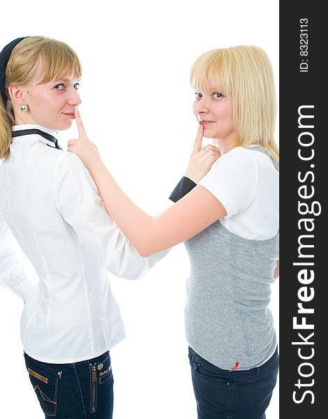 The two young glamour girls isolated on a white background