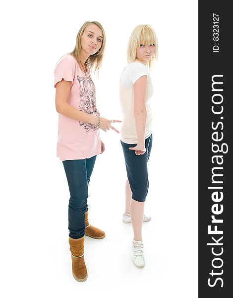 The two young glamour girls isolated on a white background