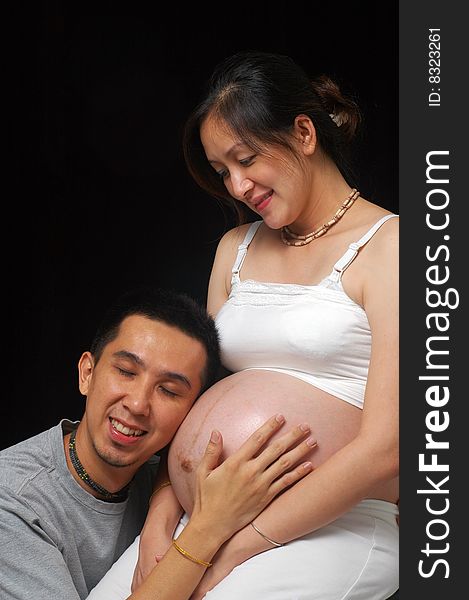 Happy asian couple expecting newborn. Happy asian couple expecting newborn