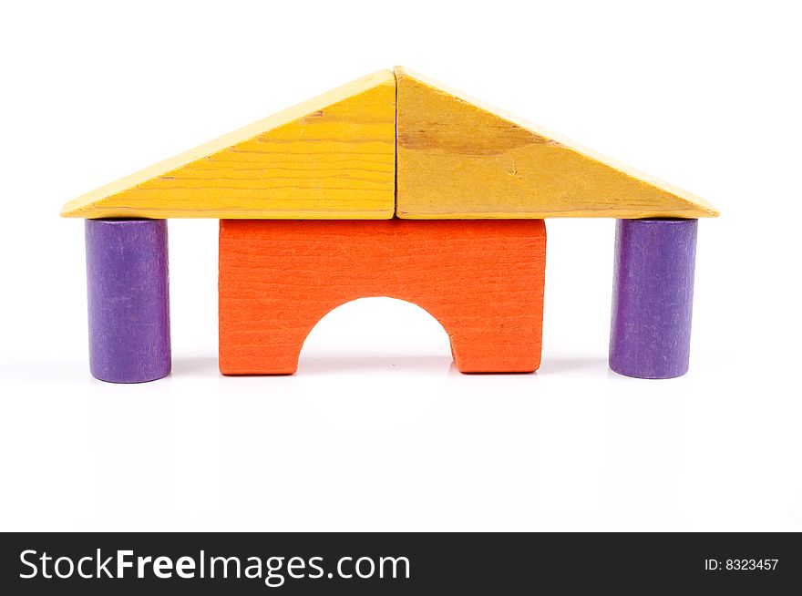 Toy blocks stacked like a house with pillars. Toy blocks stacked like a house with pillars