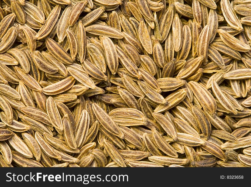 A close-up of a lot of caraway seeds