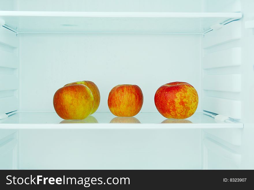 Four apple in the refrigerator