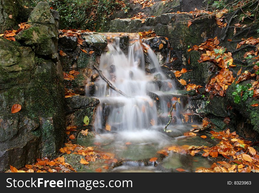 Waterfall in small stream in autumn
