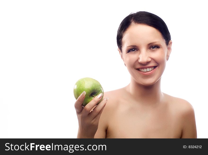 Young beautiful smiling brunette holds an apple. Young beautiful smiling brunette holds an apple