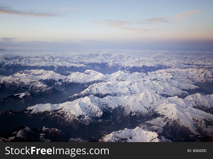 Flight over the Alpes at sunset. Flight over the Alpes at sunset