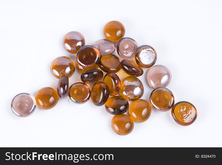 Scatted half round brown marbles. Scatted half round brown marbles