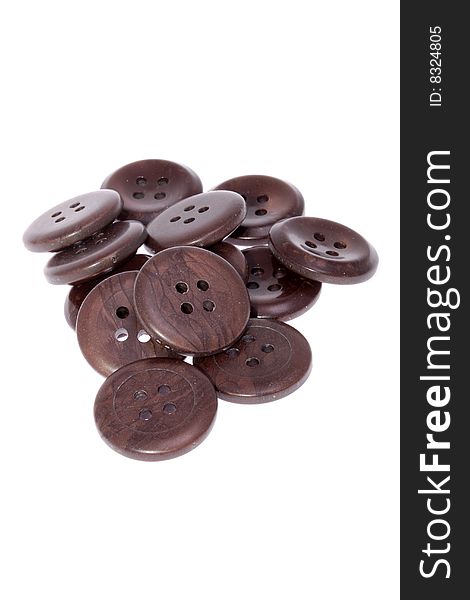 Pile of brown buttons, isolated on white background