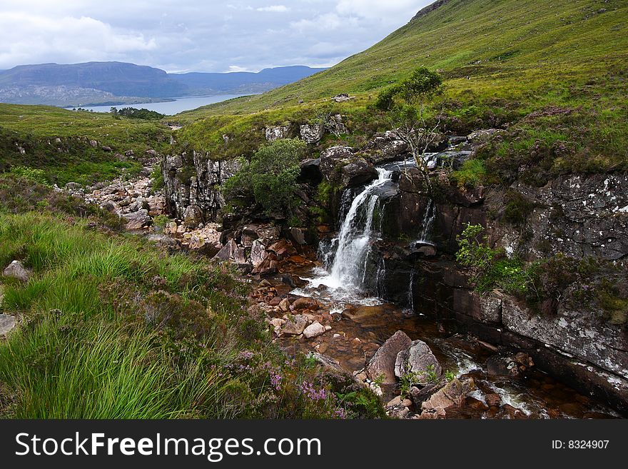 Landscape of river and waterfall in the highlands. Scottish black canyon near torridon.