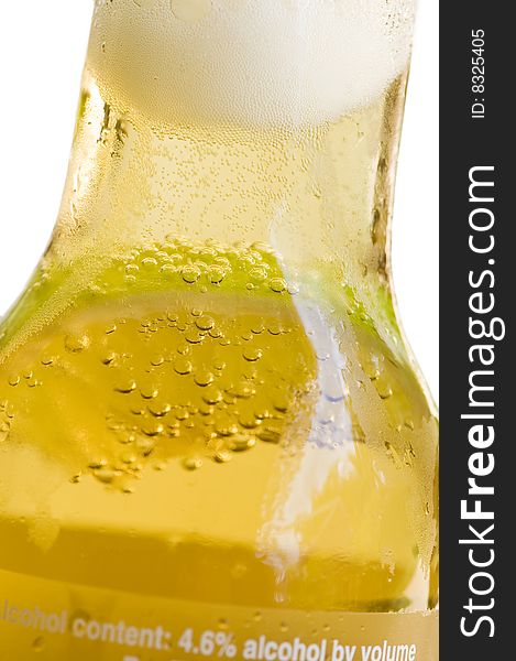 Closeup of bottle of beer with slice of lime in it