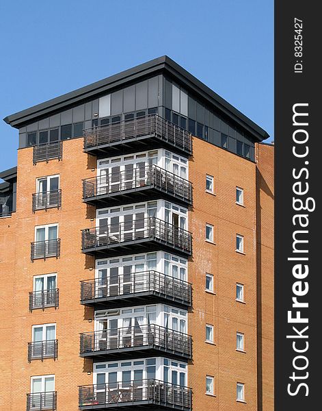 Modern residential block on side of River Thames