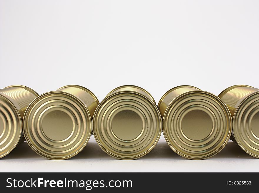Tin cans in line on white background. Tin cans in line on white background