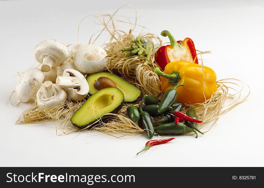 Mixed vegestables arranged on bast and isolated on a white background. Mixed vegestables arranged on bast and isolated on a white background