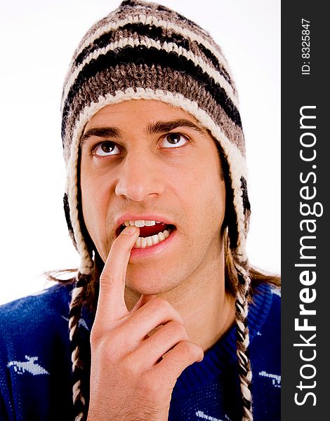 Top view of young man looking through lens against white background