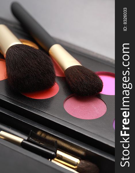 Cosmetic brushes and makeup colors. Cosmetic brushes and makeup colors