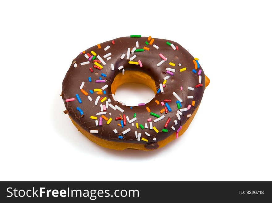 A tempting donut with chocolate icing and colorful sprinkles, isolated on a pure white background. A tempting donut with chocolate icing and colorful sprinkles, isolated on a pure white background.