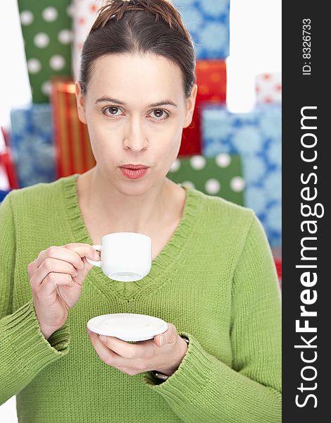 A woman having an espresso, taking a break - shallow depth of field. A woman having an espresso, taking a break - shallow depth of field.