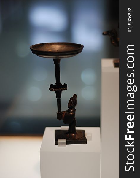 Bronze Figure Holding Lamp