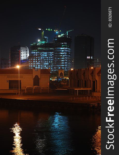 Illuminated under construction building near Dubai Creek, United Arab Emirates