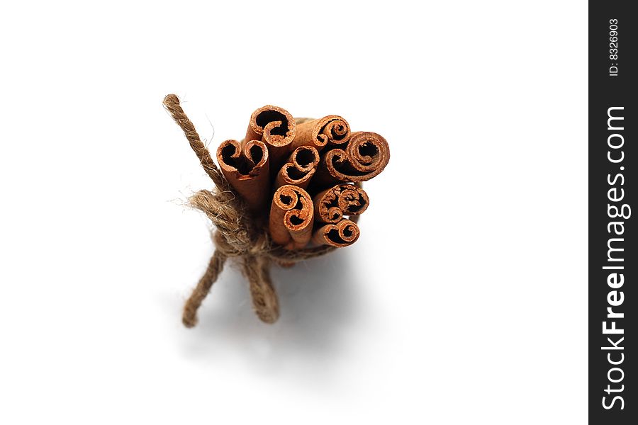 Sheaf of cinnamon sticks isolated on a white background